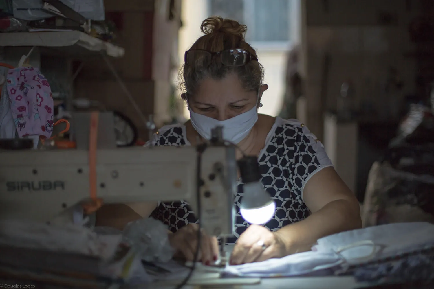 Woman sewing mask in Rio de Janeiro, credit Casa das Mulheres