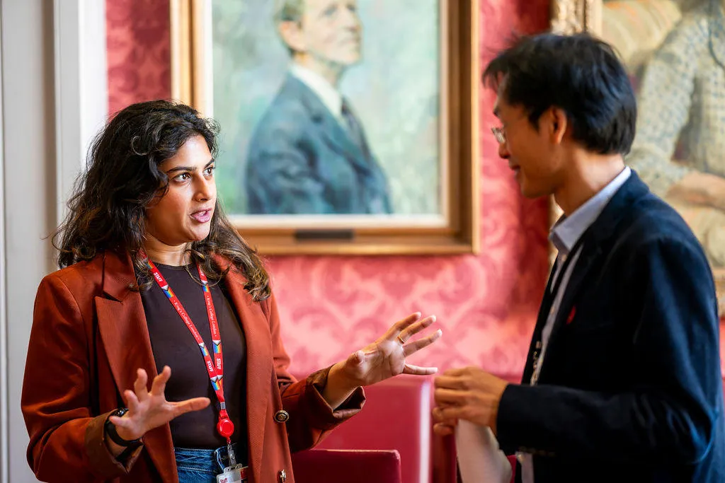 Conference participants engaged in conversation.