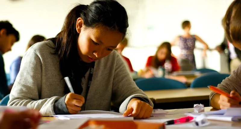 Students working at tables