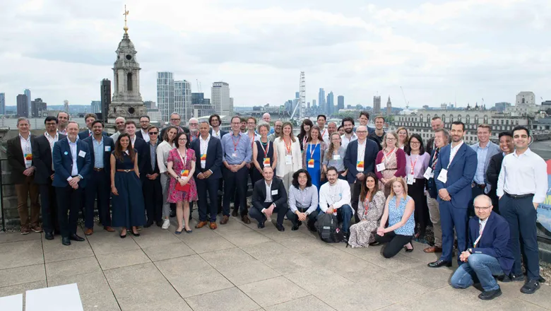 Crowd of people posing on rooftop