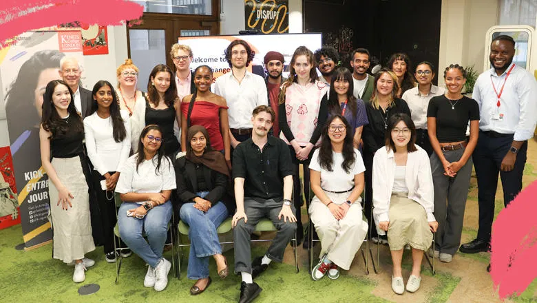 Gamechangers and interns sitting or standing in a group photo