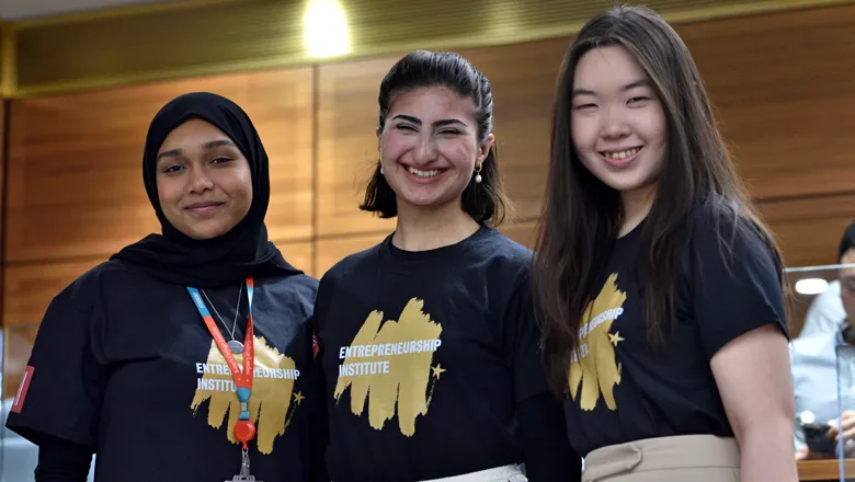 three students wearing Entrepreneurship Institute tshirts