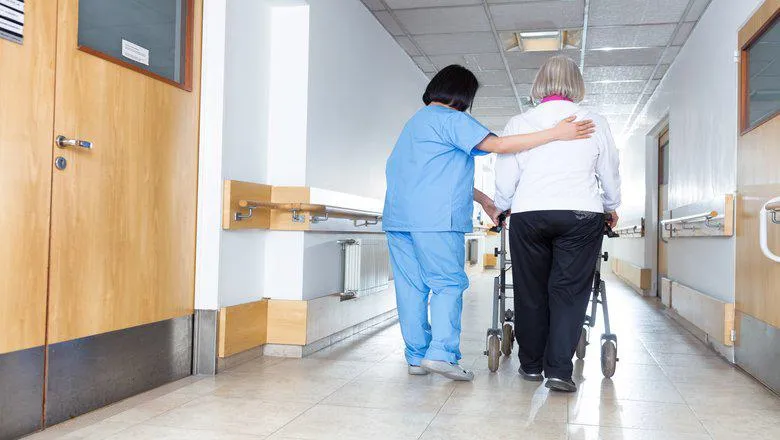 A nurse caring for a patient. 