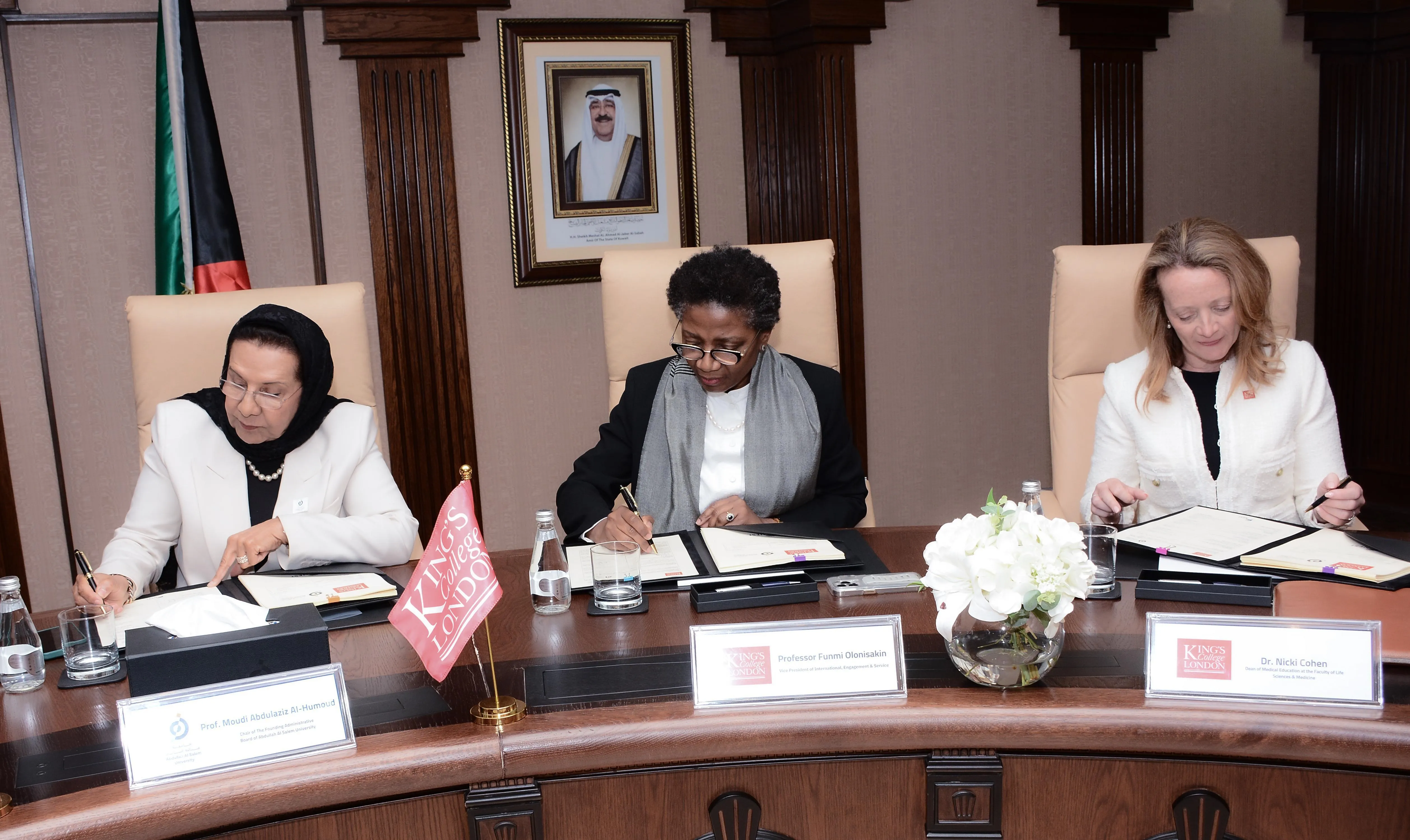 Partners from King's College London, NEST and AASU signing the MoA