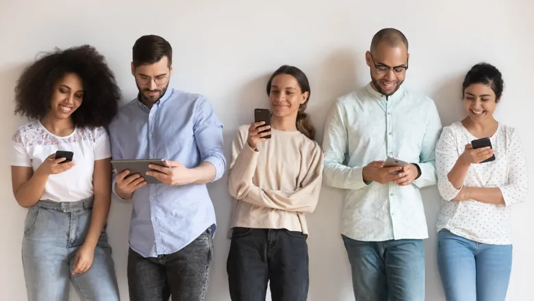 Five young people using smartphones. Image: Shutterstock.