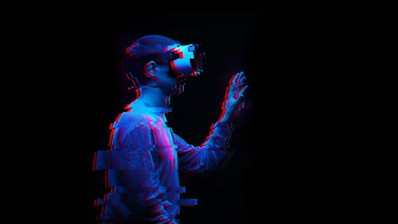 Person using VR headset. Glitch effect. Image: Adobe Stock