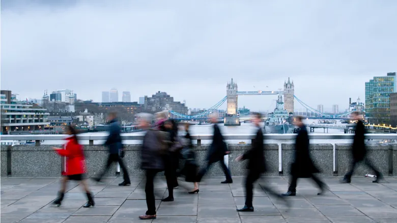 Blurry image of people crossing the London Bridge. Adobe Stock