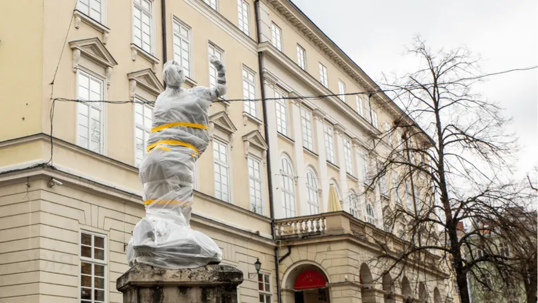 Covered statue in the centre of Lviv, Ukraine, 2022. Adobe Stock