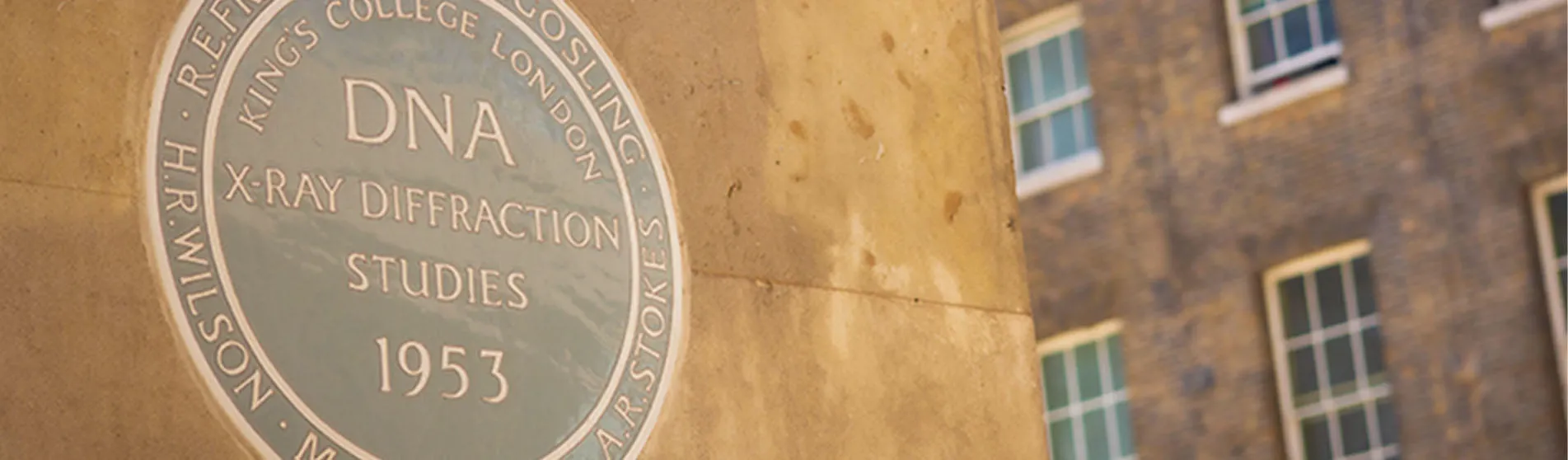 A Franklin plaque on the wall of a building.