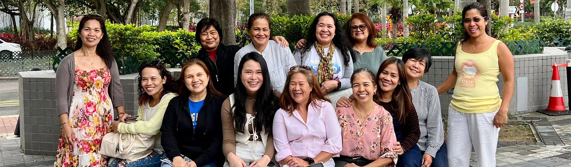 A group of women all smile at the camera