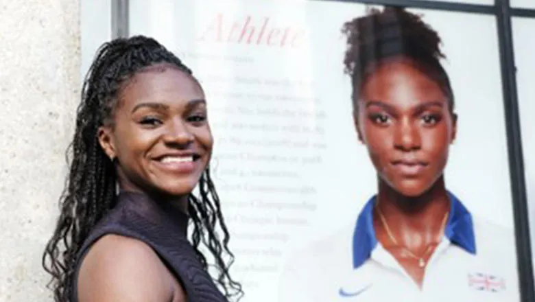 Dina Asher-Smith standing in front of her image on the King's 'Walk of Fame'