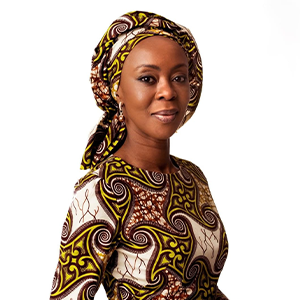 A woman wearing a colourful outfit of yellow, red and white