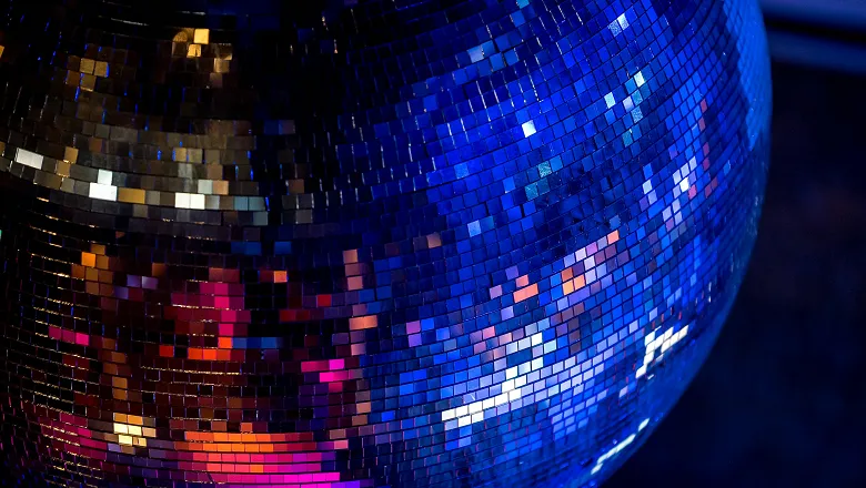 coloured lights reflecting off a mirror ball