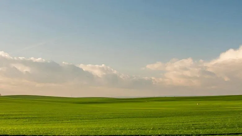 image of blue sky and field