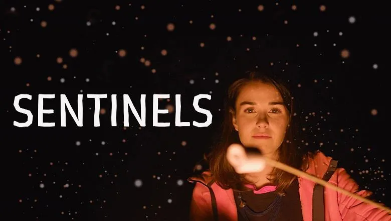 girl roasting marshmallow dark background with title treatment sentinels