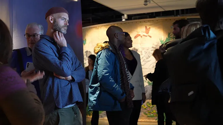 Visitors to the Vital Signs exhibition looking at an installation