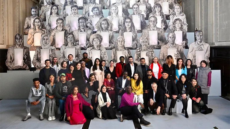 The Congregation participants stood in front of the the artwork