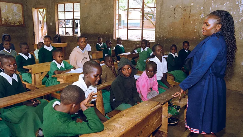 Domtila Chesang in a classroom with children