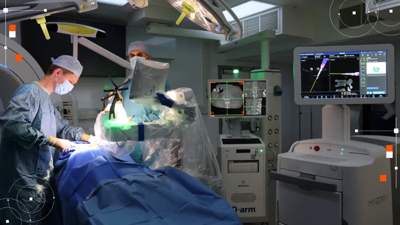 surgeons in operating theatre using mazor robot