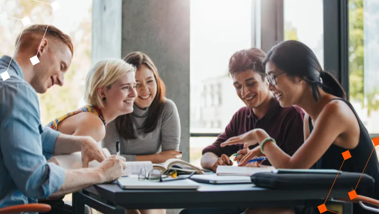 A diverse group of university students talking around a table