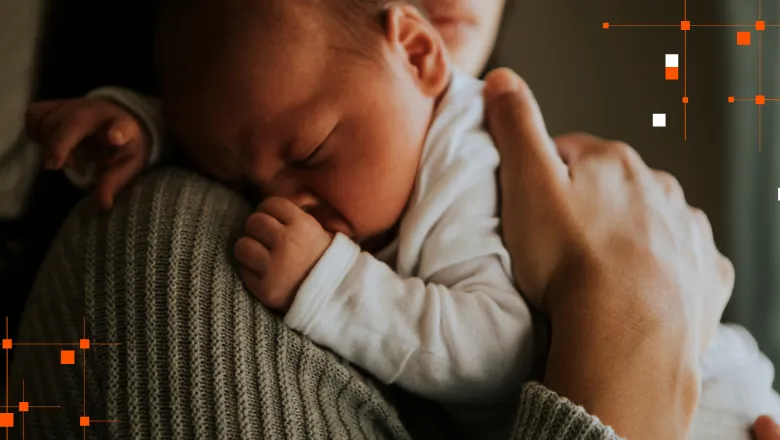 new born baby lying on a woman's shoulder