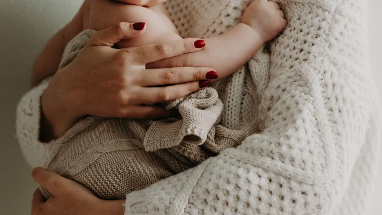 mother holding baby