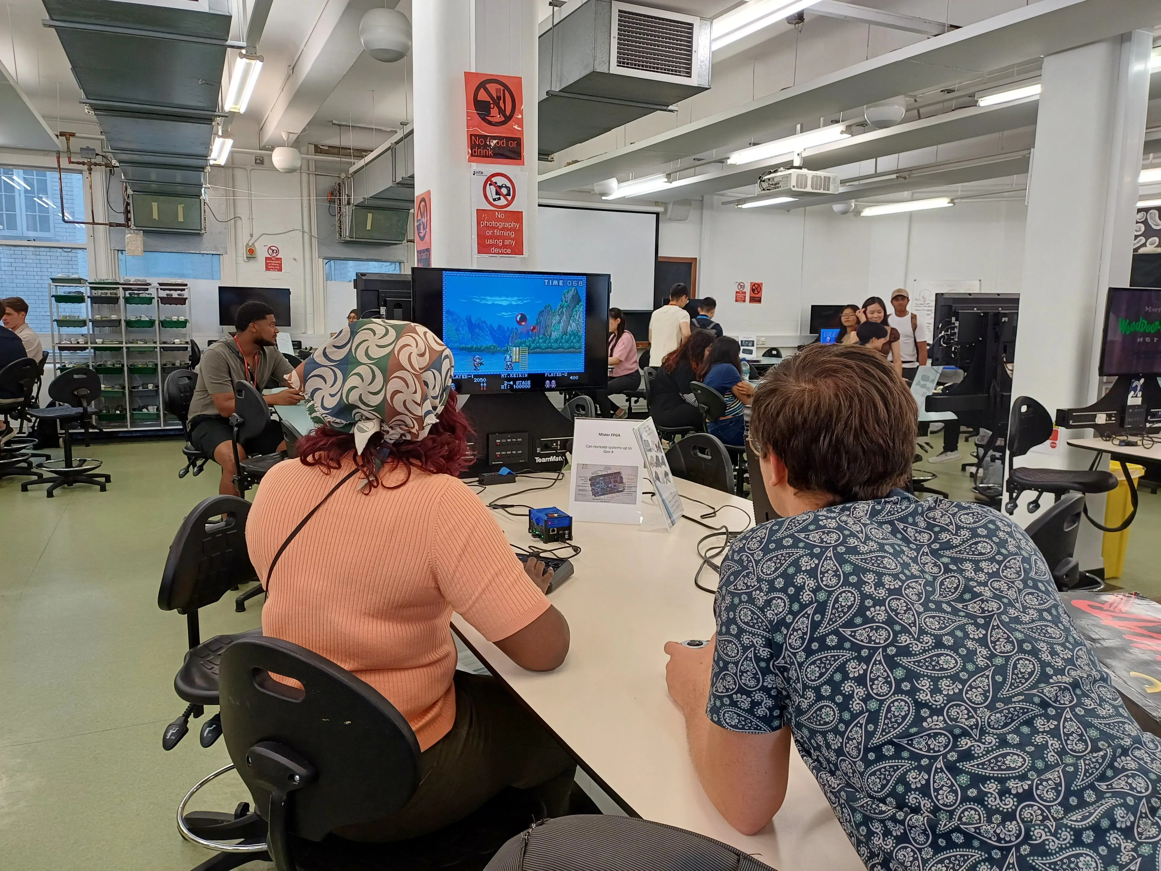 Students and staff playing retro video games