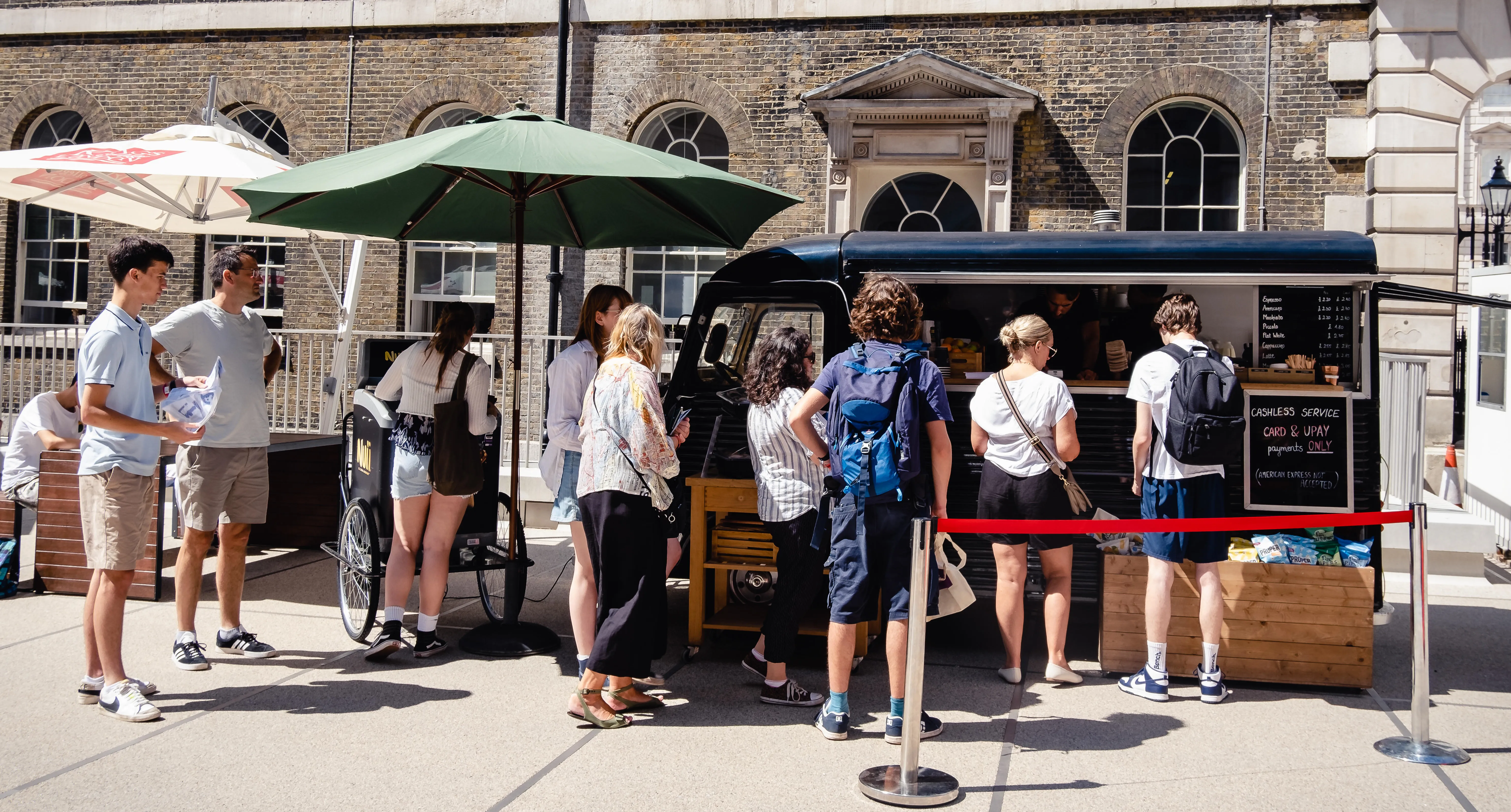 People queuing in line at a van selling coffee