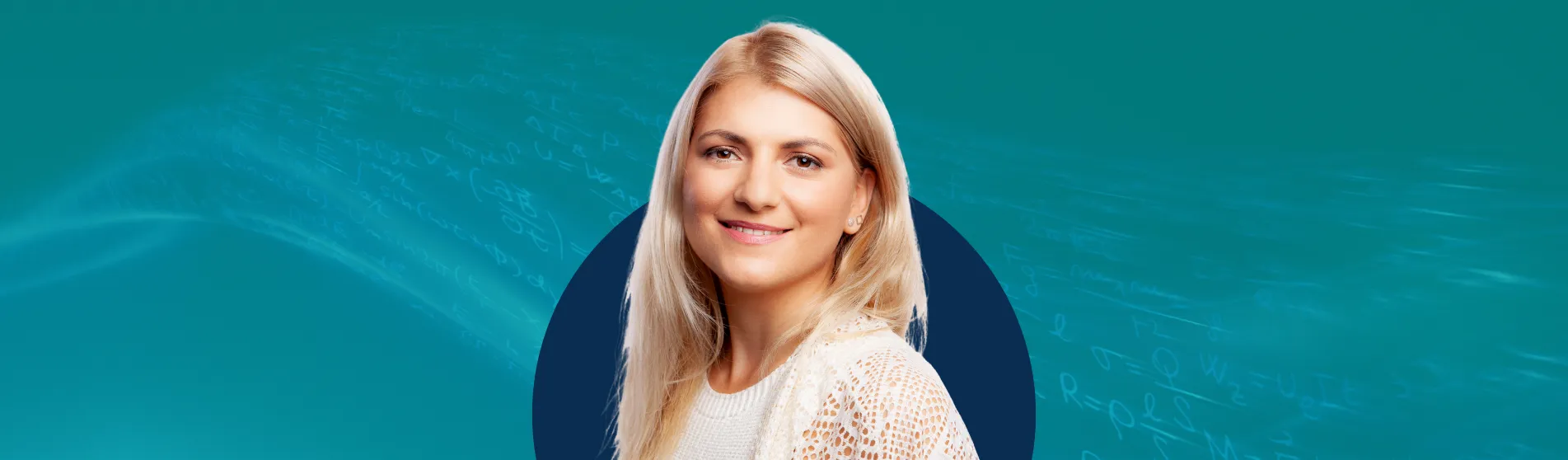 Woman smiling in front of a blue background