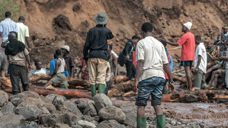 Volunteers clean up after mud slide