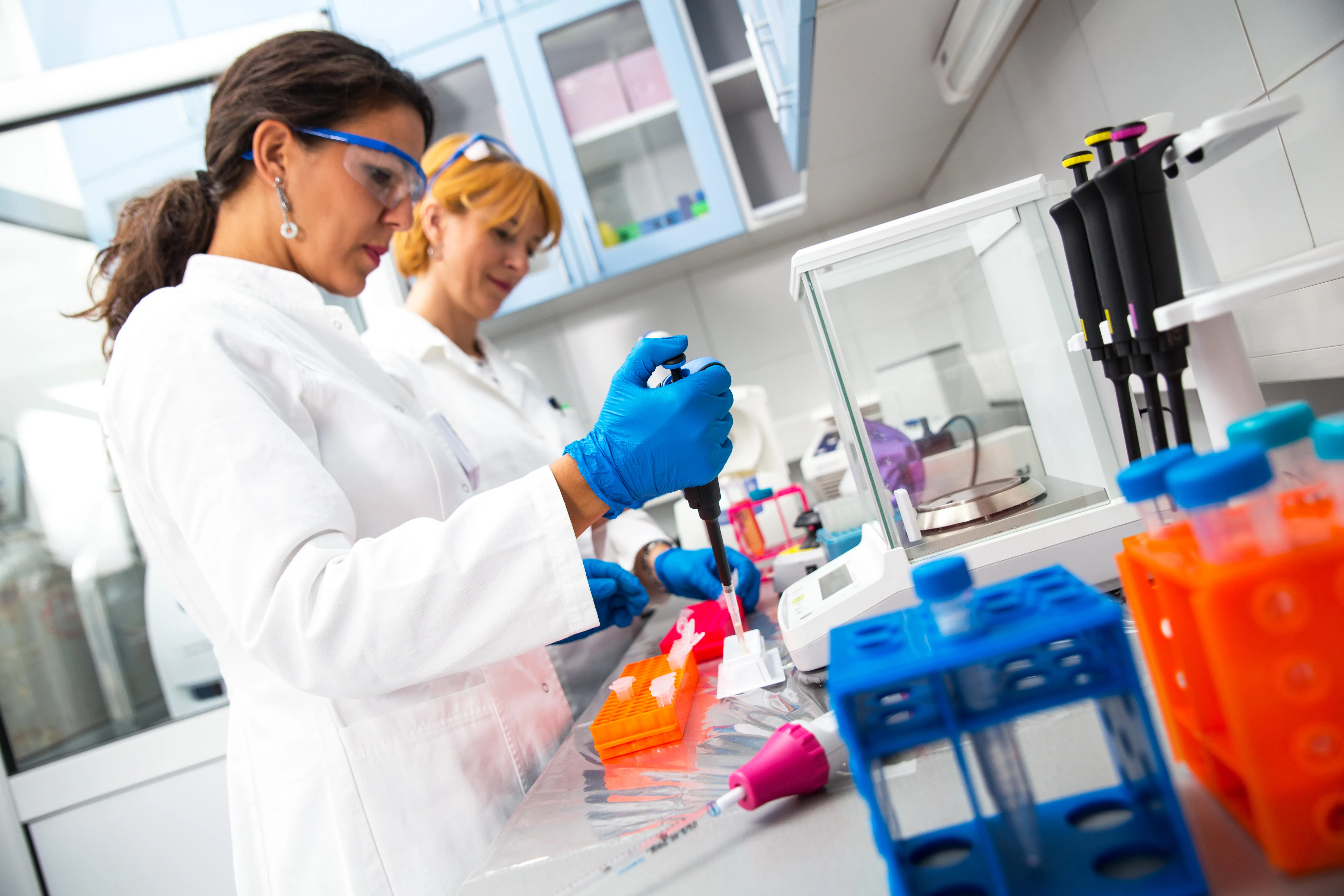 Two women in research labs 