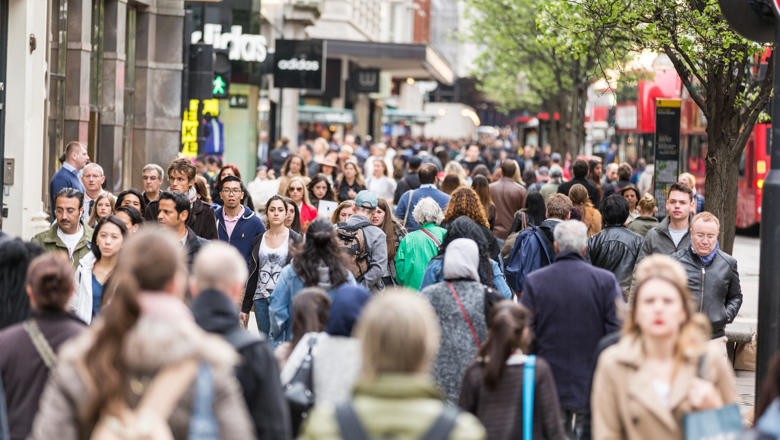 Busy street full of people in London
