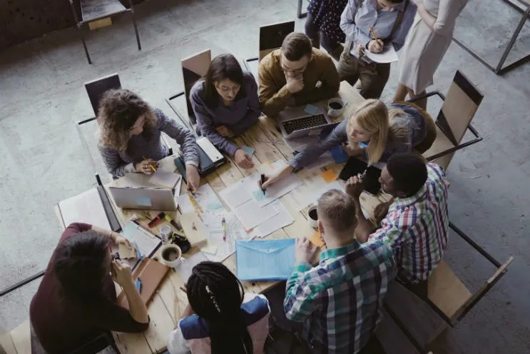 research-group-working-around-table-mobile