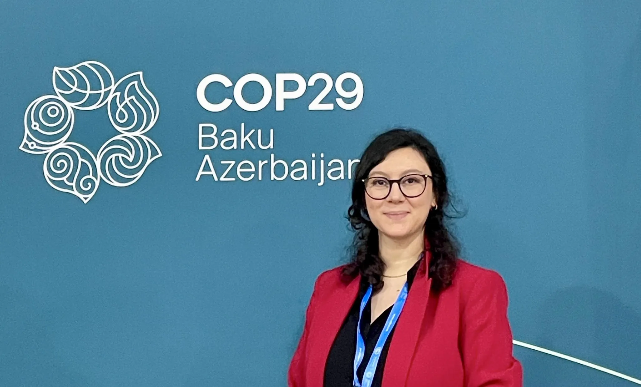 Simal Erdogan by COP29 sign