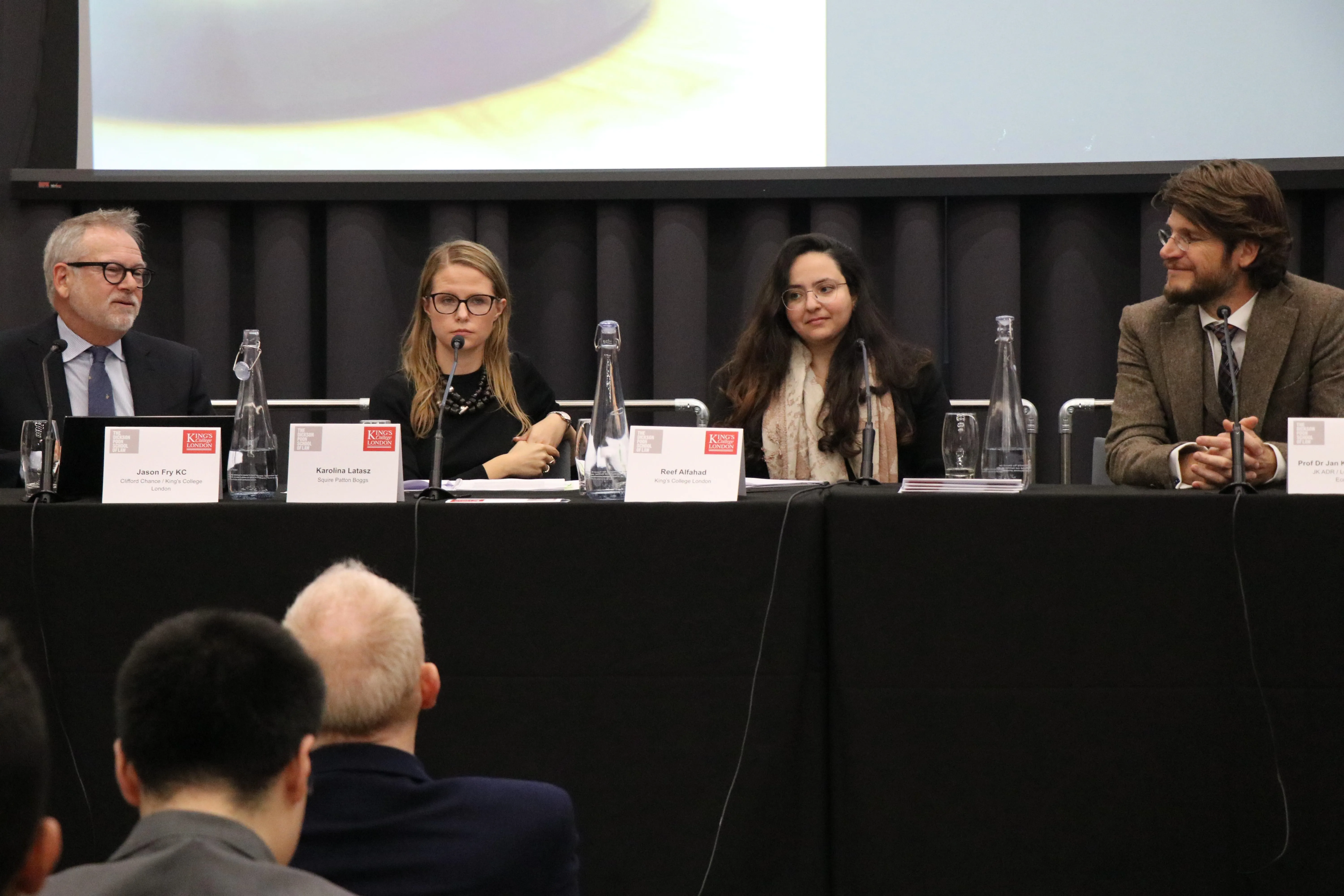 Image of two women and two men speaking on a panel