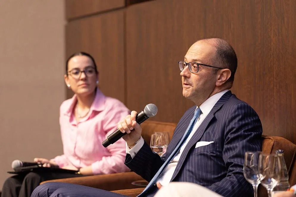 Two people speaking at an event