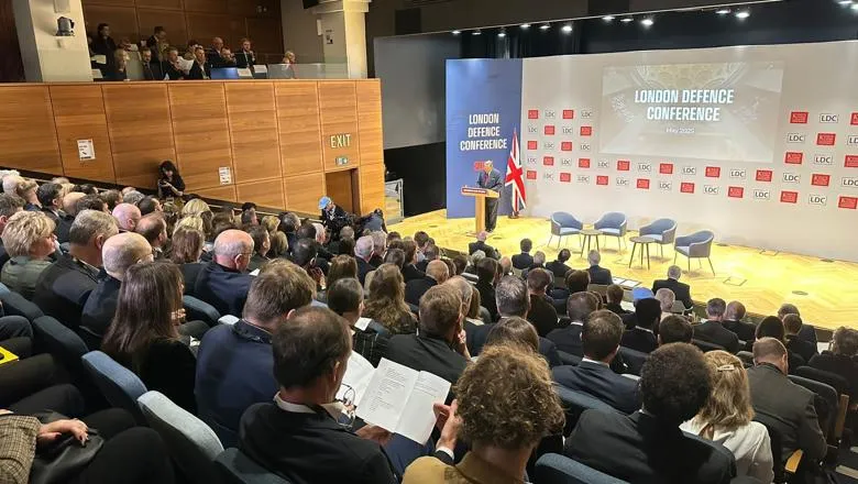 Audience looking at man talking at event