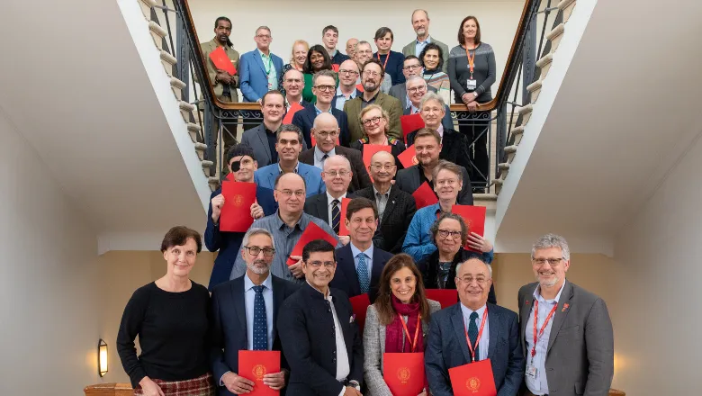 Group photo with awardees gathered on Bush House stairs