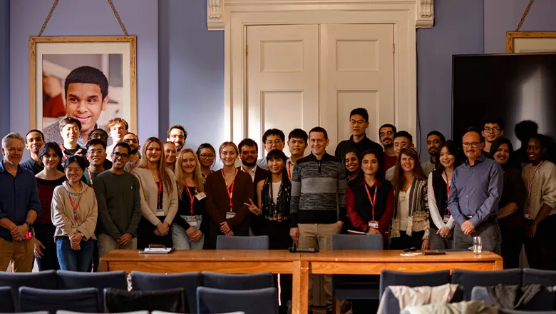 Dr John Jumper and students at King's