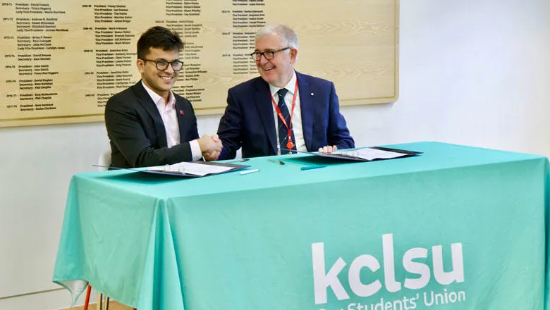 Principal Ed Byrne shakes hands with KCLSU President Shaswat Jain