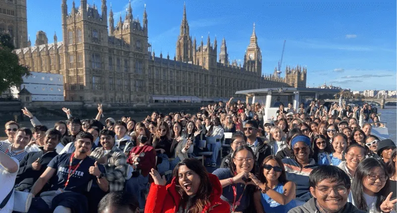 New students on a boat tour outside the houses of parliament.