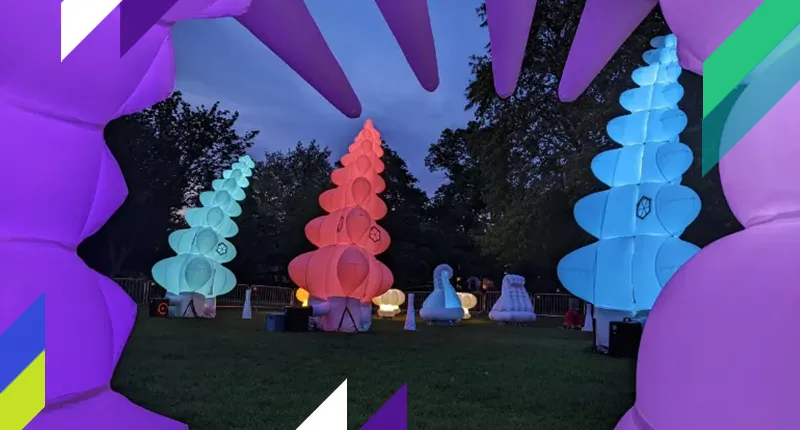 Glowing inflatable robots at dusk on the Strand