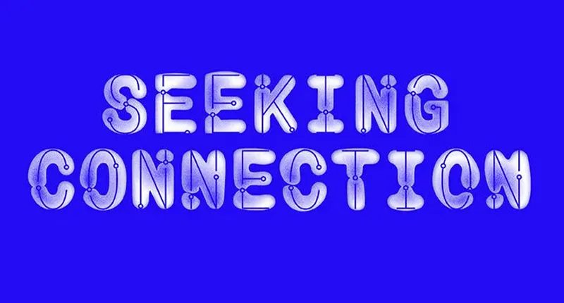 The words 'Seeking Connection' written on a blue background in the style of a glowing circuit board