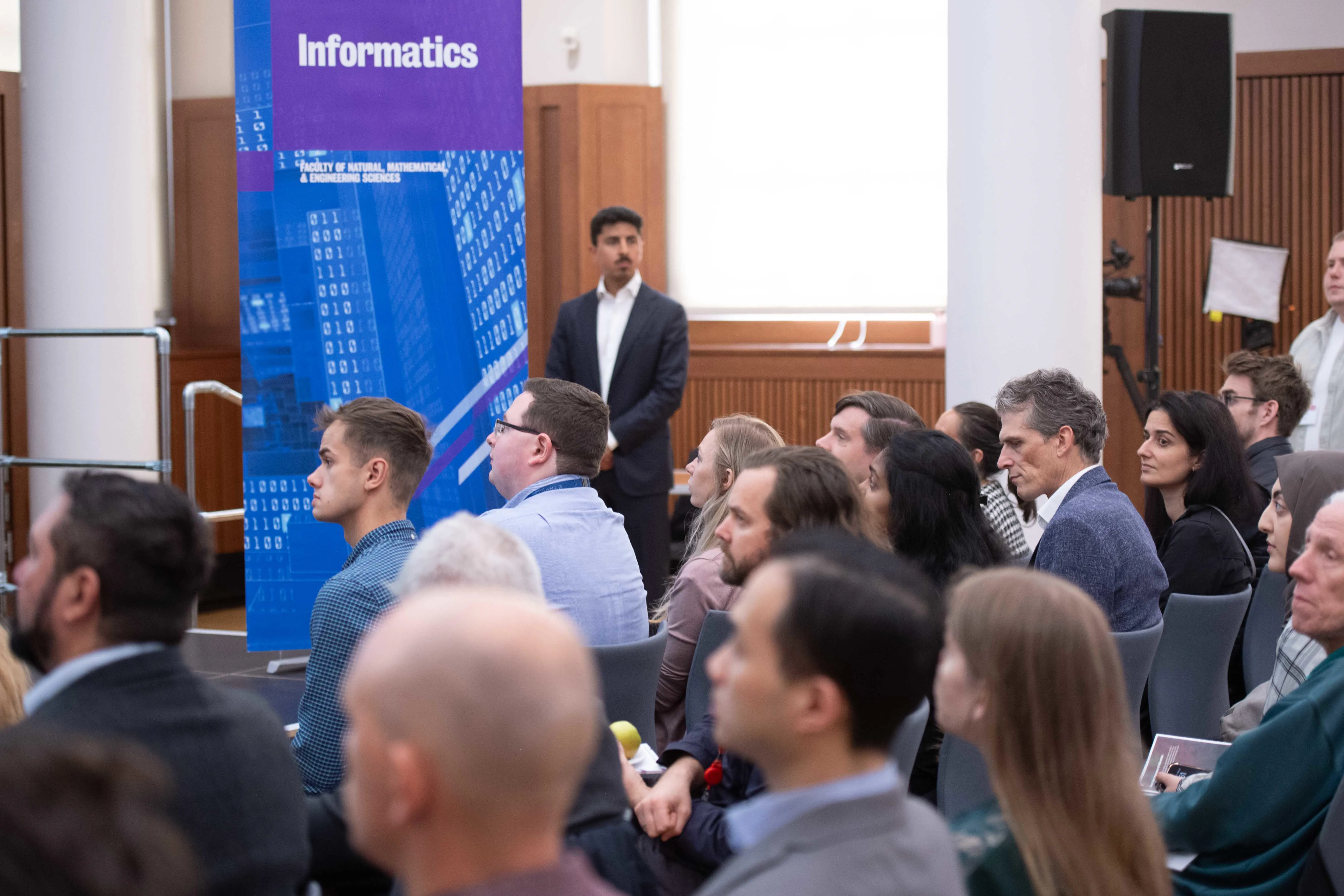 Audience listening to a presenter