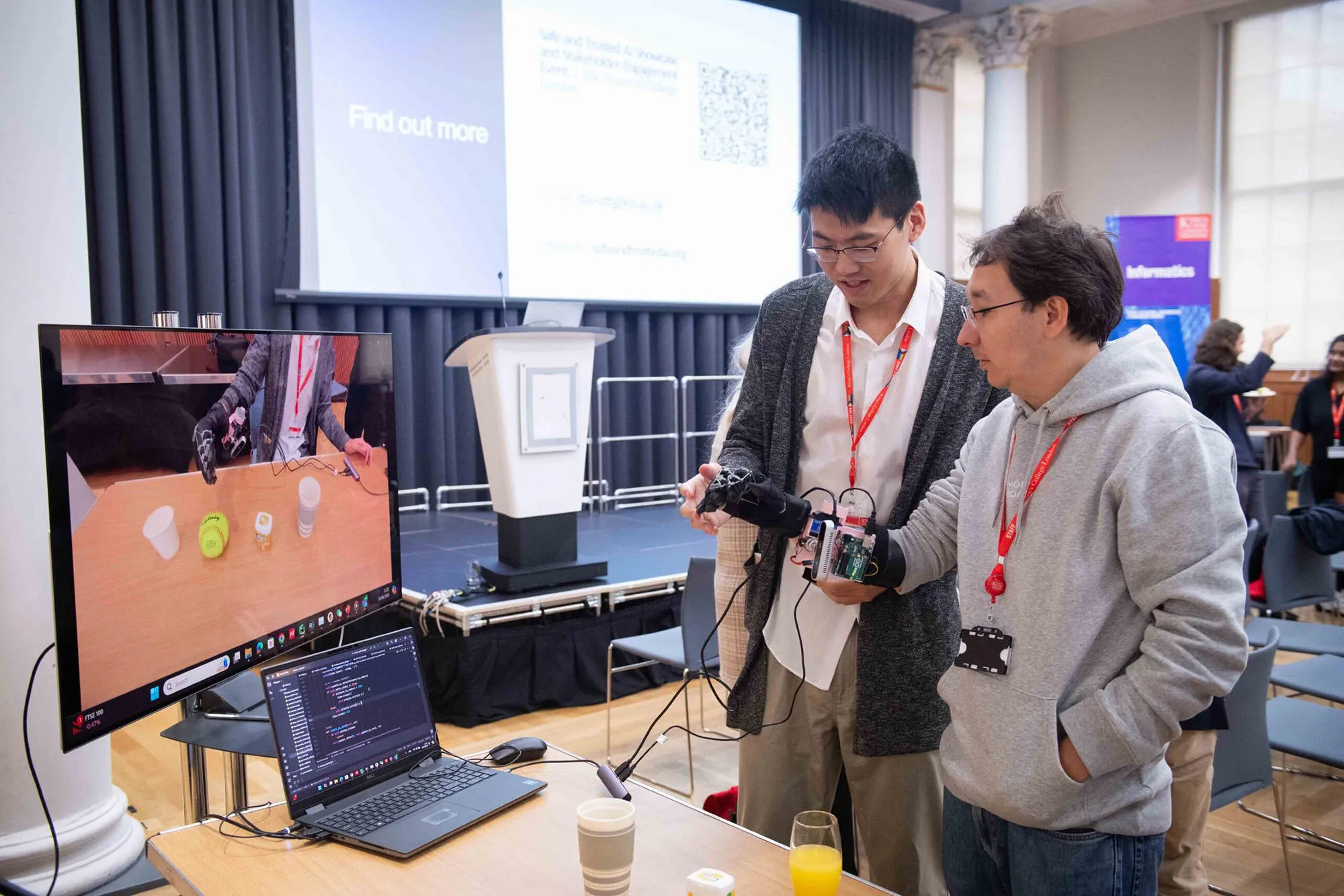 A student presenting and talking about a sensor glove