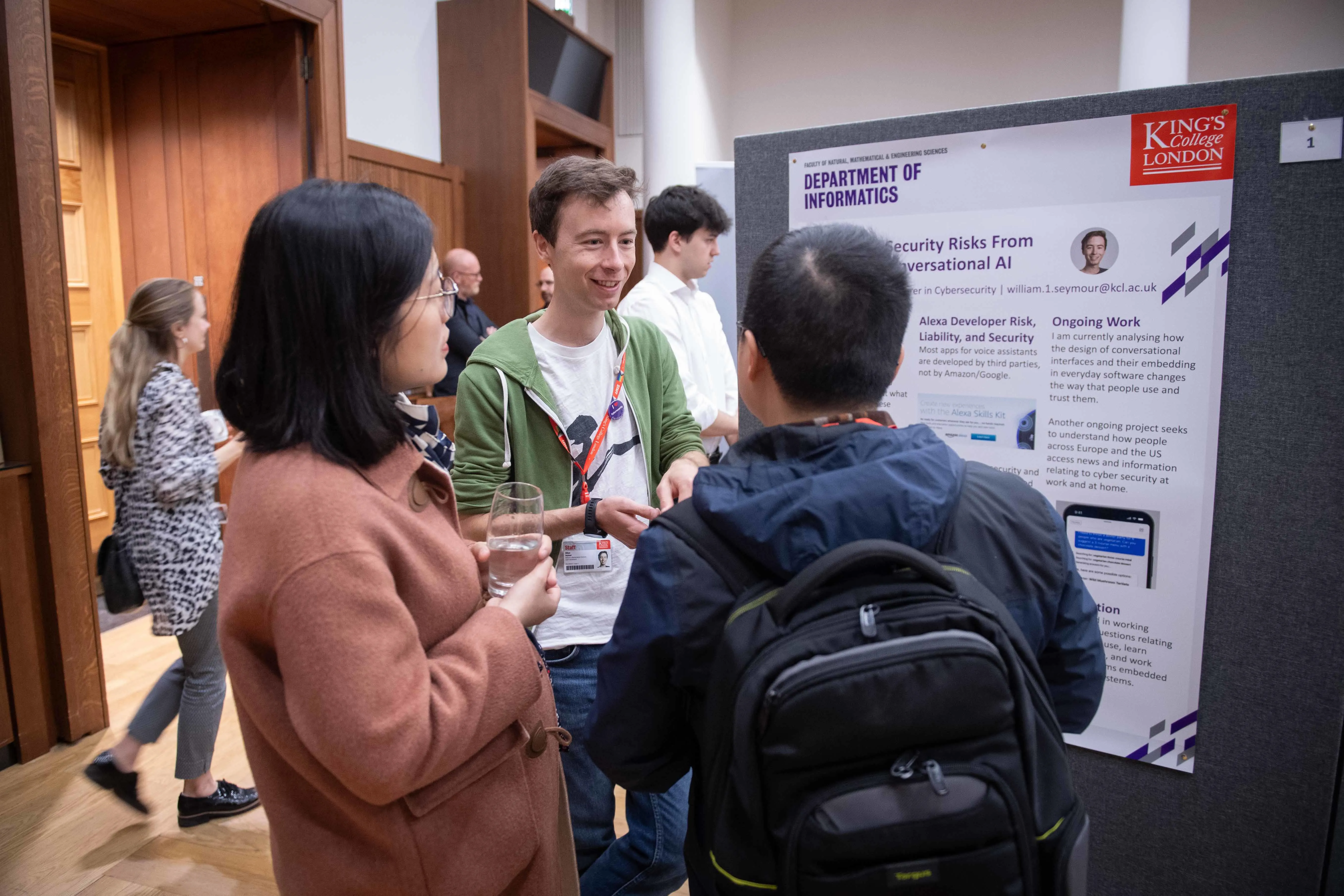 A man presenting his poster