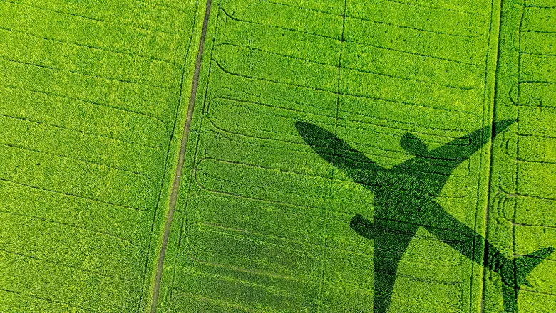 Christos EPSRC sustainable aviation shadow of a plan flying over grass
