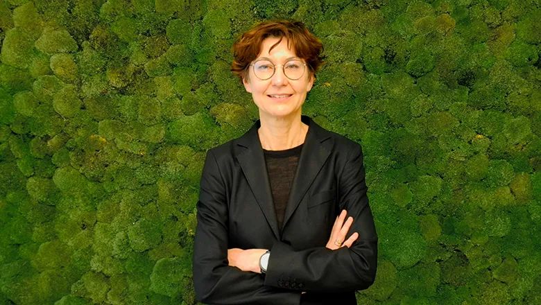 Giovanna Tinetti against a living green wall