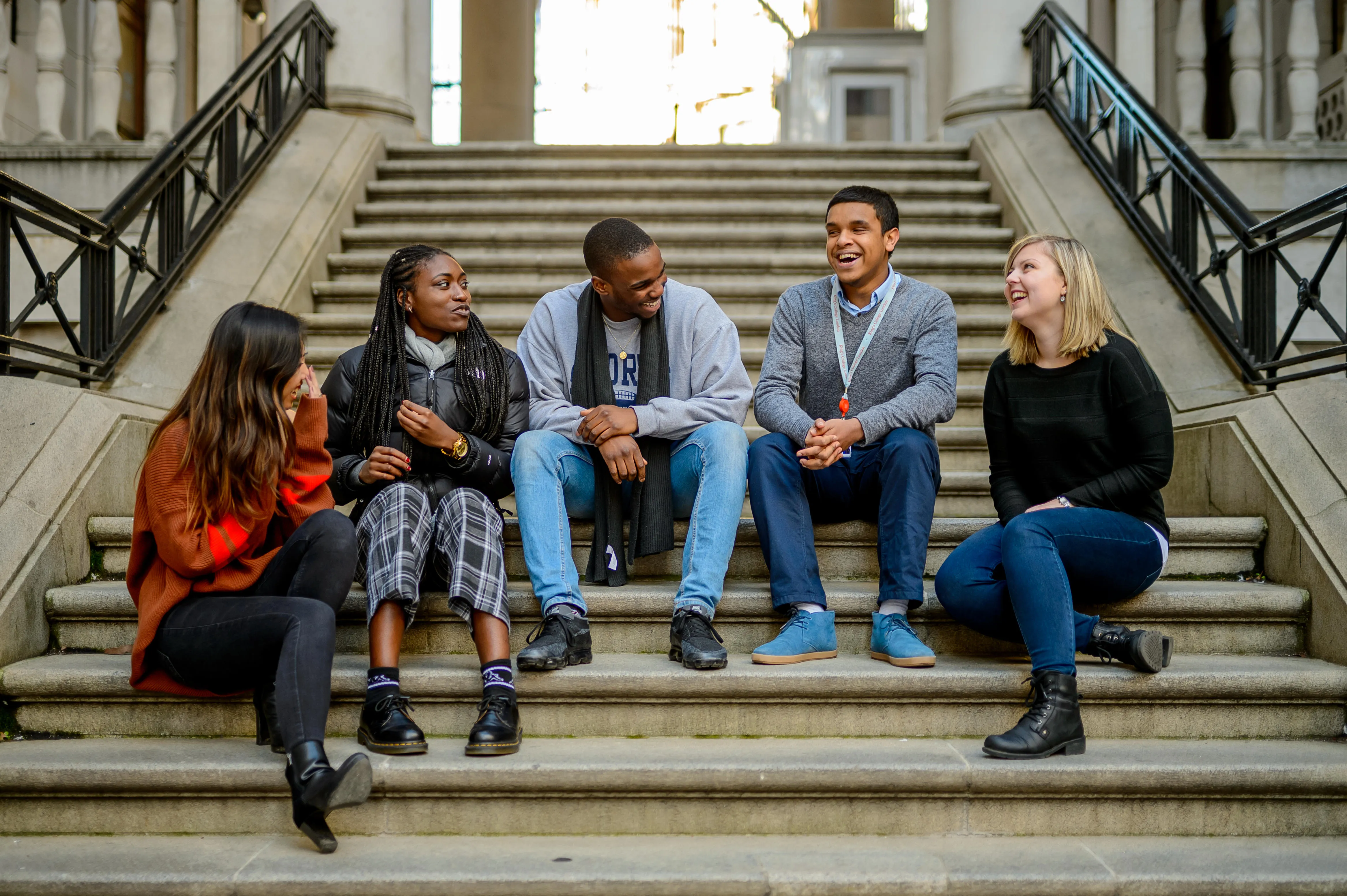 students talking stairs