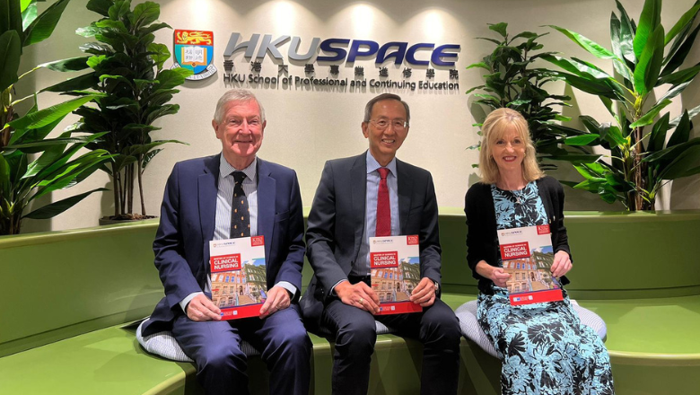 Three people sit in front of a wall with the HKU SPACE logo, holding King's prospectuses